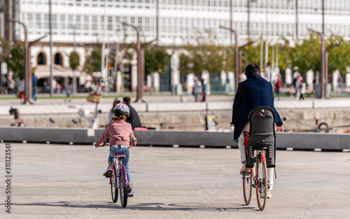 Father and daughter riding bicycle in the park © Bujia