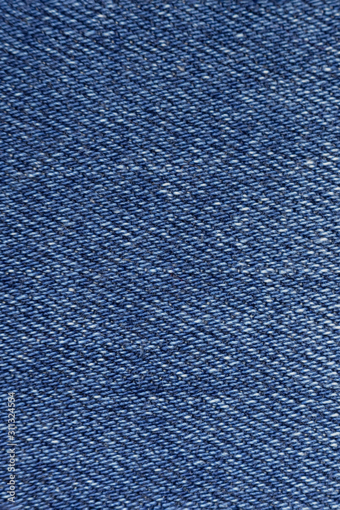 Blue denim background close-up Blue denim background close-up