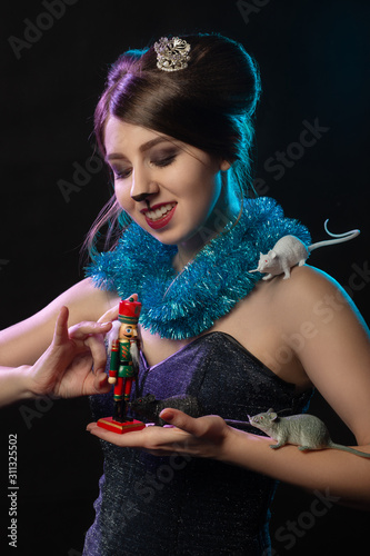 girl plays with Nutcracker toy photo