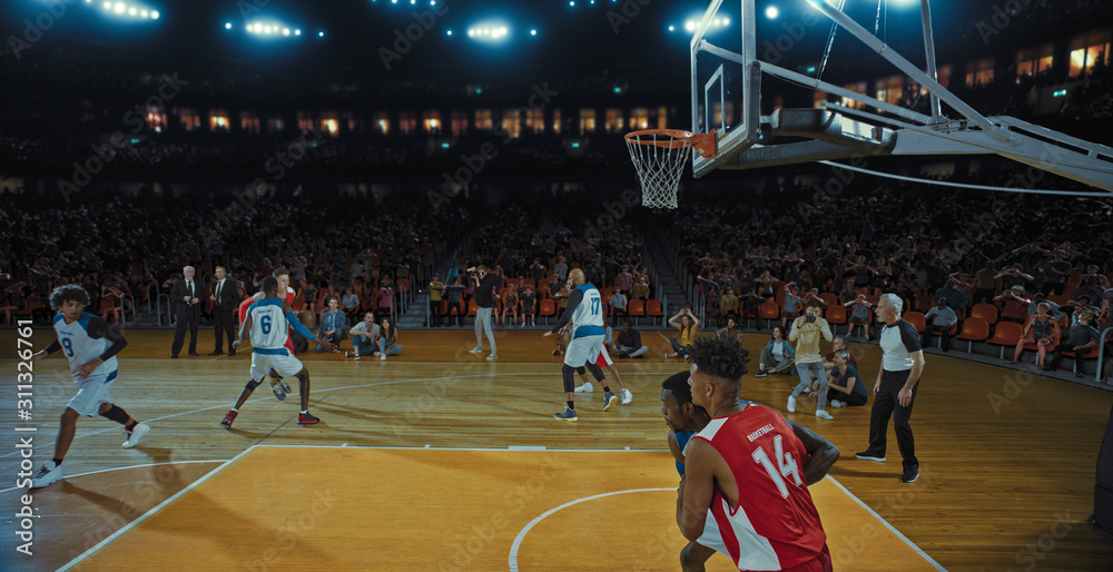 Fototapeta premium Basketball players on big professional arena during the game. Tense moment of the game. Celebration