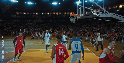 Wallpaper Mural Basketball players on big professional arena during the game. Tense moment of the game. Celebration Torontodigital.ca