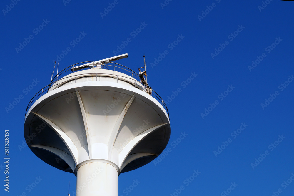       round concrete tower on a background of blue sky             