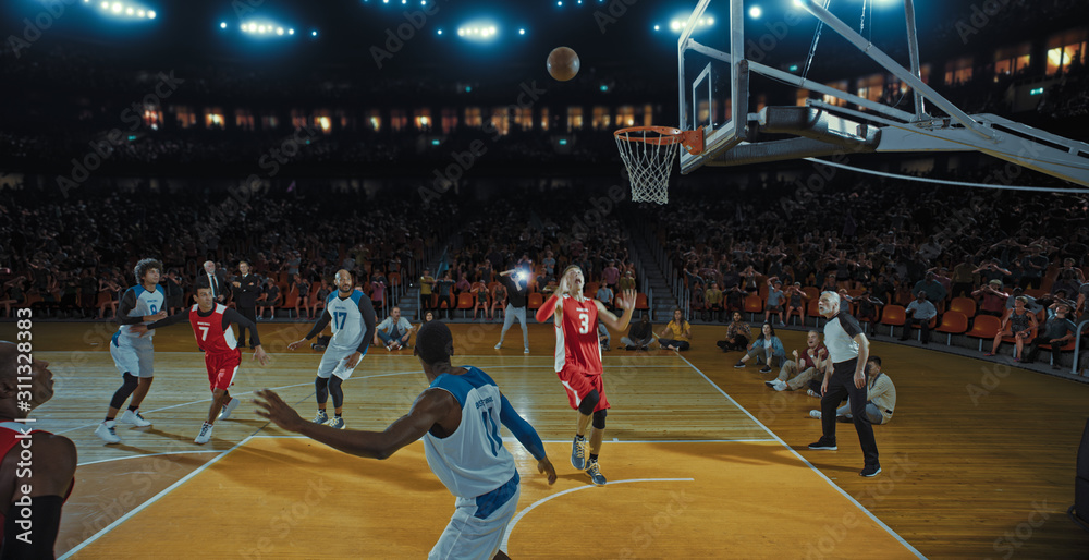Obraz premium Basketball players on big professional arena during the game. Tense moment of the game. Celebration