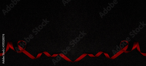 Red wavy ribbon on black background. Holiday decoration. Valentine's Day decoration congratulation frame.