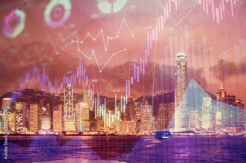 Multi exposure of forex chart drawings over cityscape background. Concept of success.