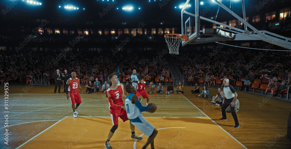 Fototapeta premium Basketball players on big professional arena during the game. Tense moment of the game. Celebration