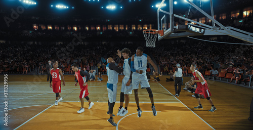 Wallpaper Mural Basketball players on big professional arena during the game. Tense moment of the game. Celebration Torontodigital.ca