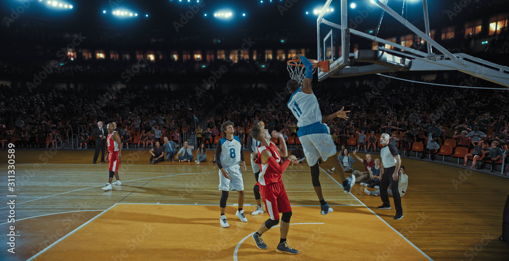 Obraz premium Basketball players on big professional arena during the game. Tense moment of the game. Celebration
