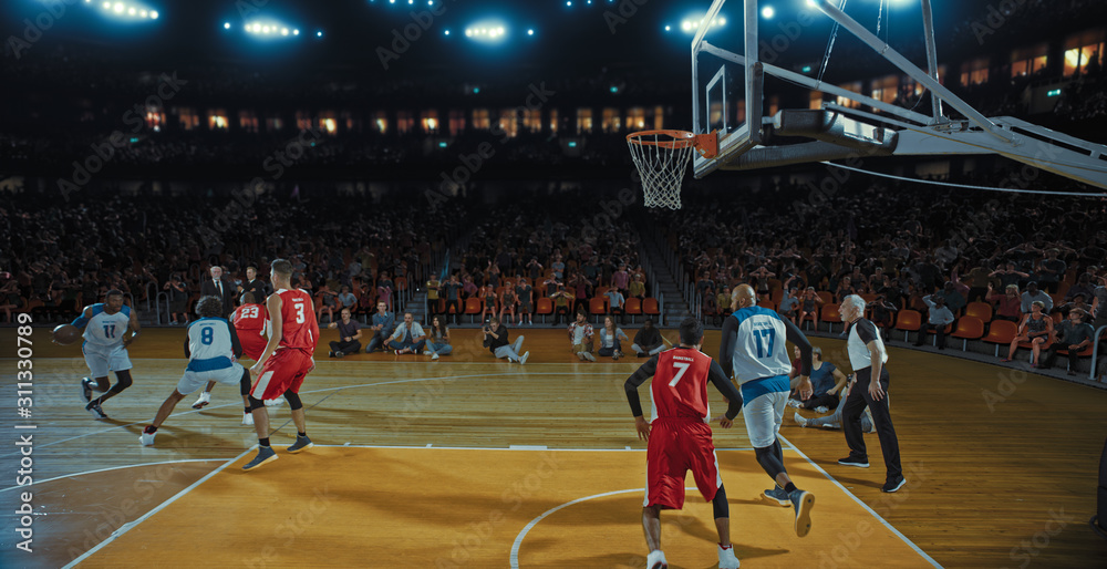 Fototapeta premium Basketball players on big professional arena during the game. Tense moment of the game. Celebration