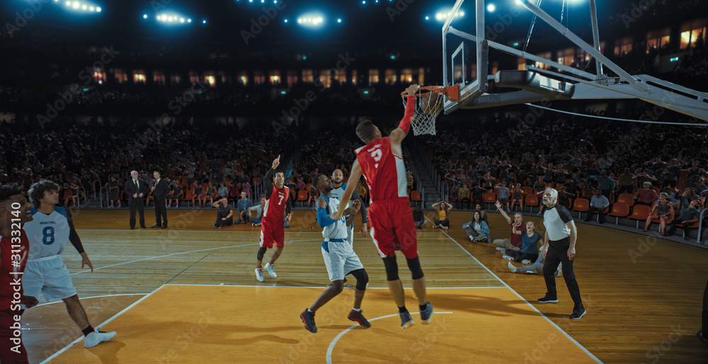 Obraz premium Basketball players on big professional arena during the game. Tense moment of the game. Celebration