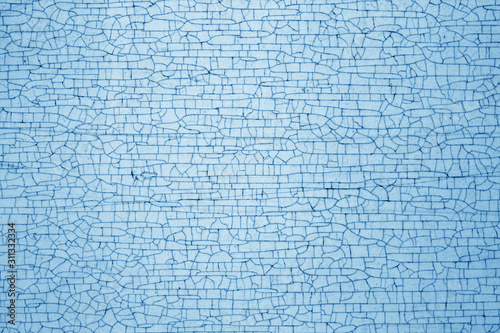 Cracks on metal texture in navy blue tone.