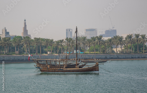 Doha, Qatar - located at the Eastern side of the Corniche, the Dhow Harbour is one of the main landmarks of Doha, and show a full display of traditional boats and vessels photo