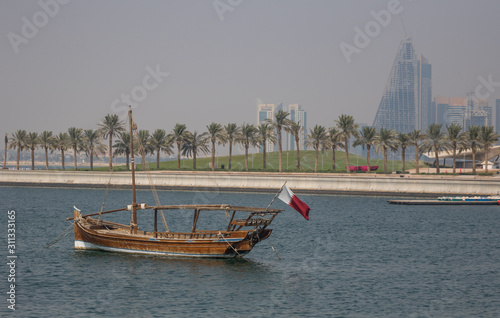 Doha, Qatar - located at the Eastern side of the Corniche, the Dhow Harbour is one of the main landmarks of Doha, and show a full display of traditional boats and vessels photo