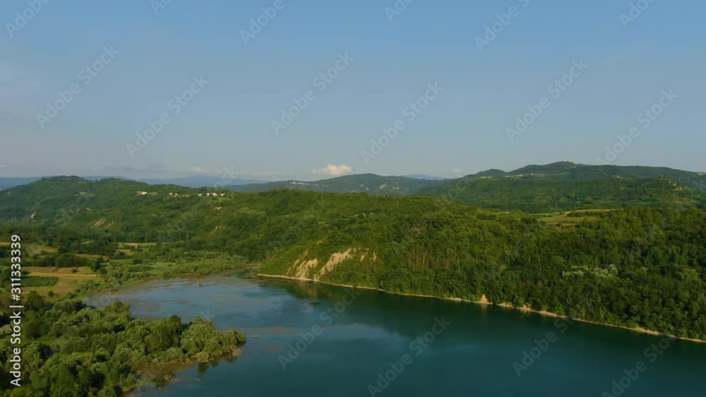 Lake Butoniga water dam in Croatia shore approach, Aerial drone left pan reveal shot Lake Butoniga water dam in Croatia shore approach, Aerial drone left pan reveal shot