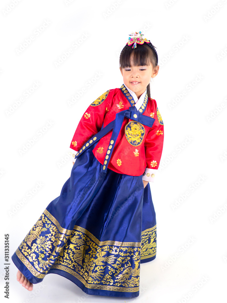 Asian little girl wearing a Korean Traditional Hanbok dress in white background[The pattern on the fabric is Fu Lu Shou refers to the three Chinese deities]