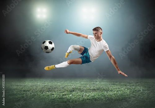 Soccer player on a football field in dynamic action at summer da