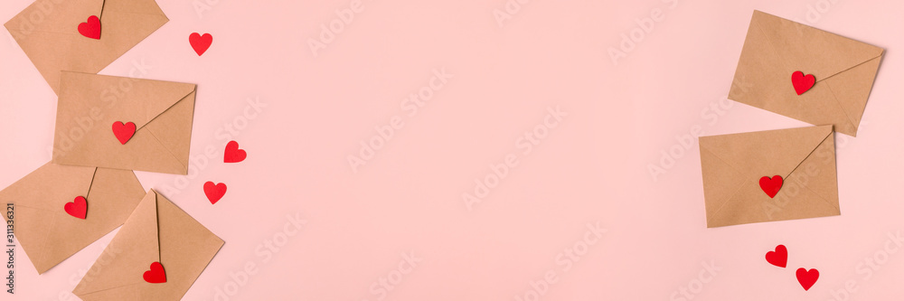 Valentines day banner made of brown envelops and red paper heart
