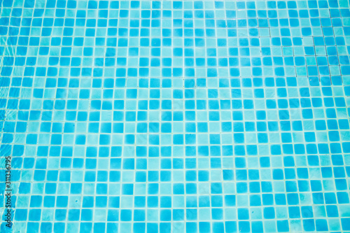Top view of the color of the blue tiles in the pool. Blue tiles arranged in the free pool at the resort.