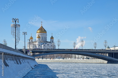 View of the Cathedral of Christ the Savior and the Big Stone bridge in early spring. Moscow, Russia