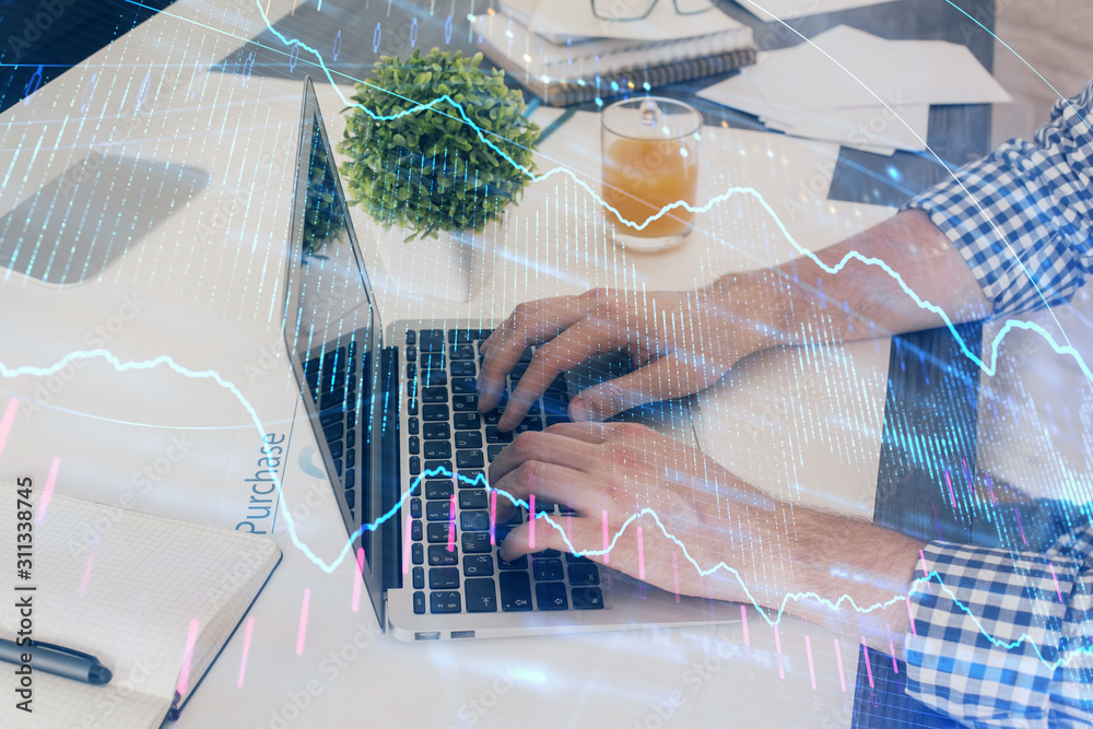 Multi exposure of graph with man typing on computer in office on background. Concept of hard work. Closeup. Multi exposure of graph with man typing on computer in office on background. Concept of hard work. Closeup.