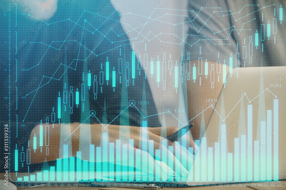 Forex graph with businessman typing on computer in office on background. Concept of analysis. Double exposure. Forex graph with businessman typing on computer in office on background. Concept of analysis. Double exposure.