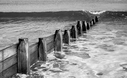 Fototapeta Naklejka Na Ścianę i Meble -  Rising sea level water erosion at water barrier defence 