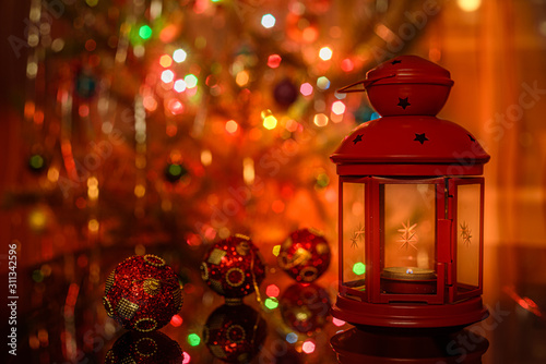 Red lantern and red christmas balls in christmas interior.