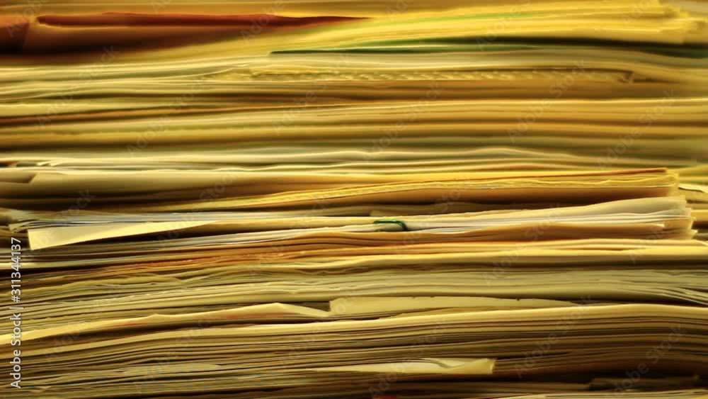 Stacks of old documents in the old archive. Brown, old data files. Stacks of old documents in the old archive. Brown, old data files.