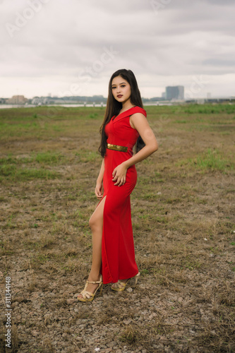 Potraiture beautiful women wear red dress at outdoor