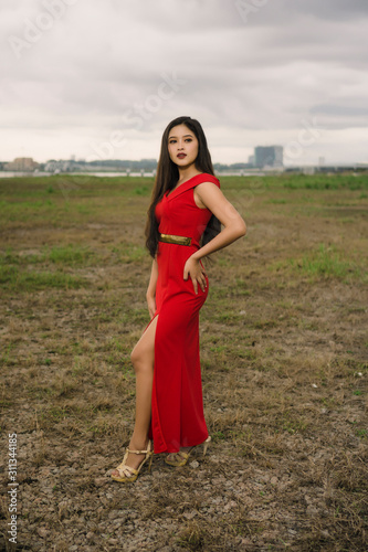 Potraiture beautiful women wear red dress at outdoor