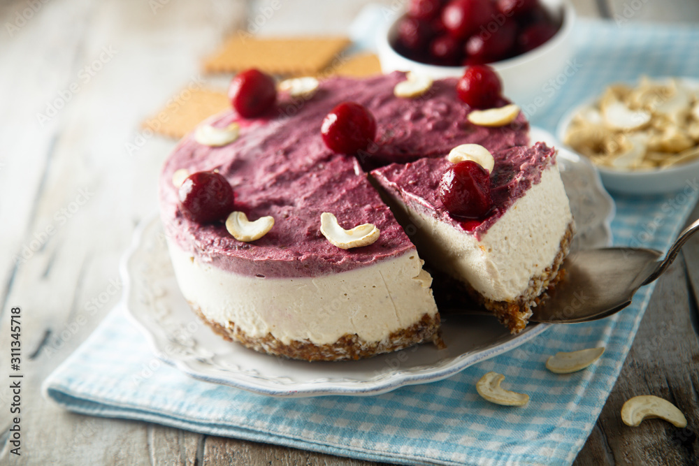 Raw vegan cheesecake with cherry and cashew nuts Raw vegan cheesecake with cherry and cashew nuts