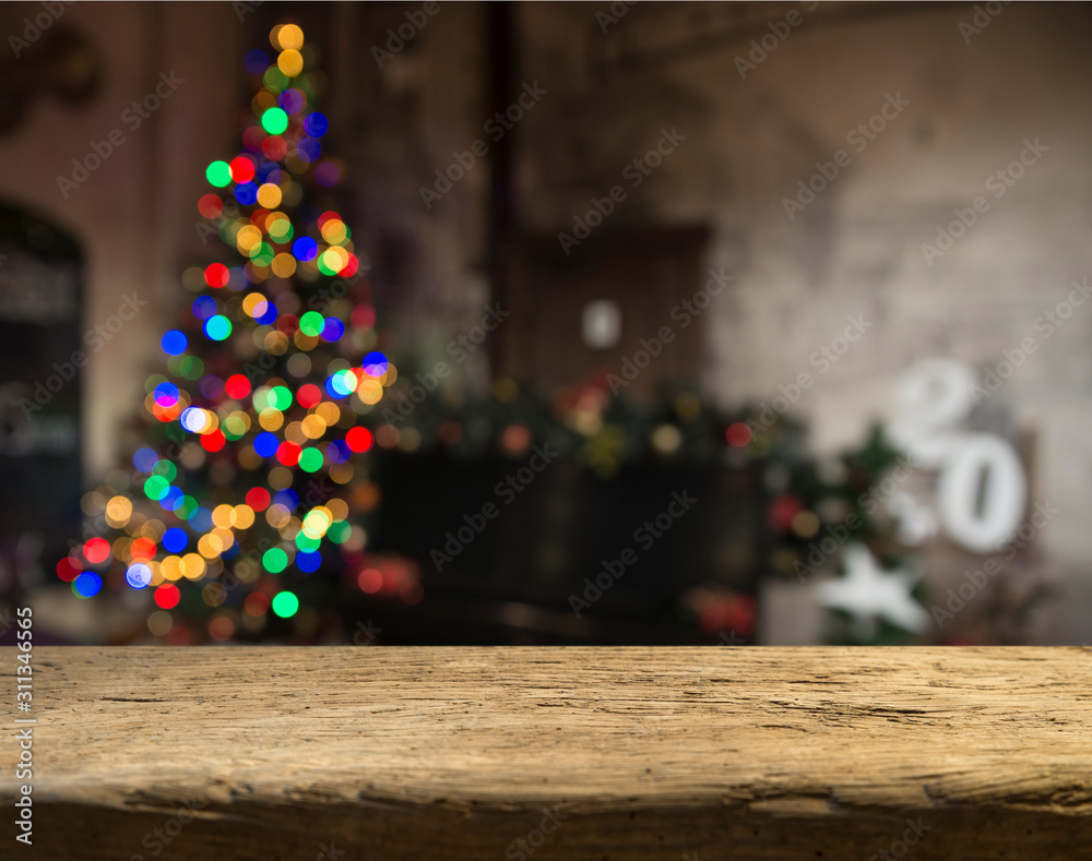 Empty table in front of christmas tree with decorations background. For product display montage. Empty table in front of christmas tree with decorations background. For product display montage.