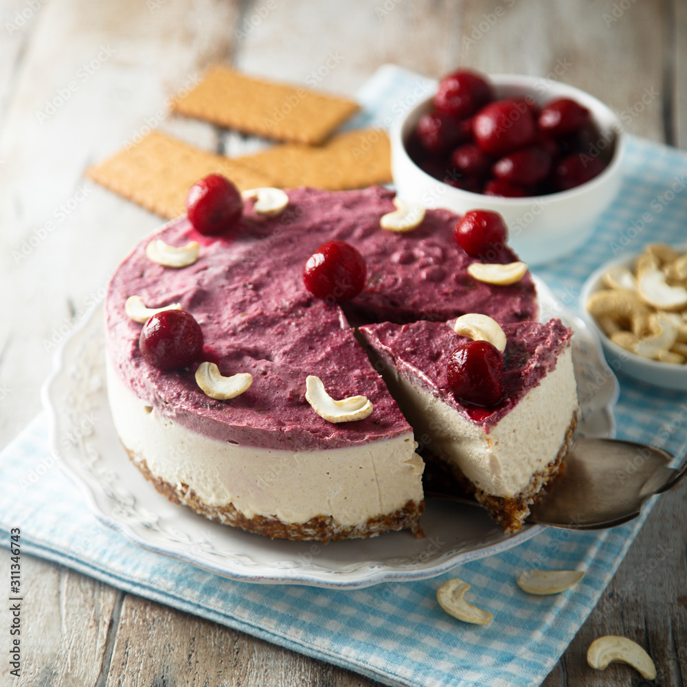 Raw vegan cheesecake with cherry and cashew nuts Raw vegan cheesecake with cherry and cashew nuts