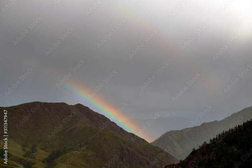 Mountain landscape in Altai. Rainbow.