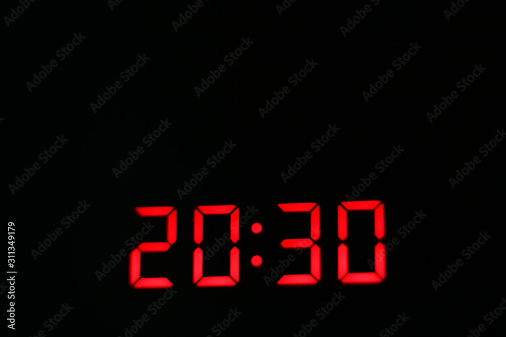 Macro of a digital red clock.