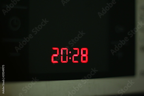 Macro of a digital red clock.