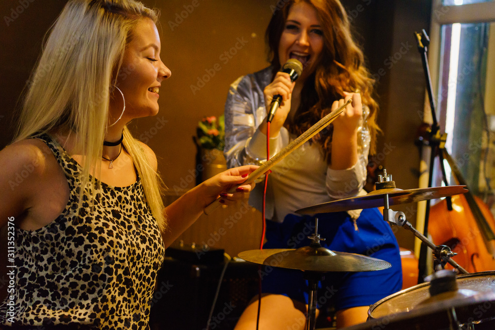 Woman singing, band playing instruments. Woman singing, band playing instruments.