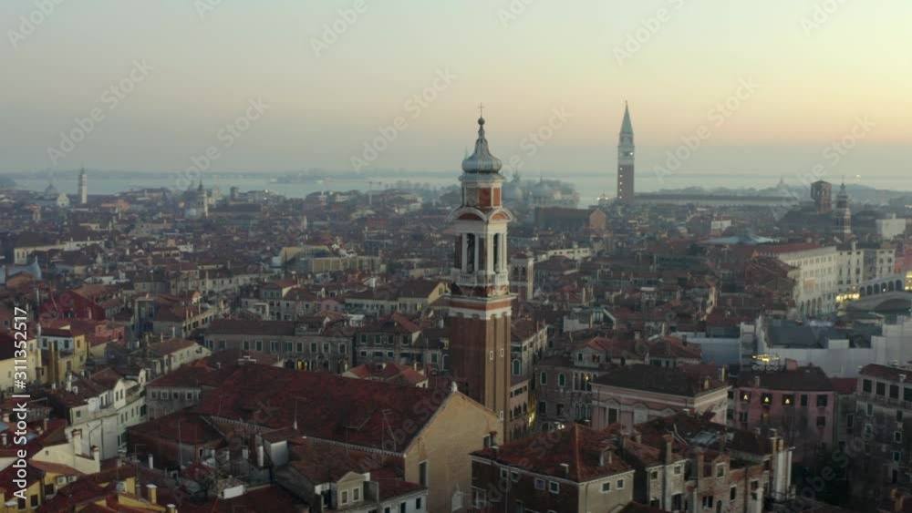 Aerial, tracking, drone shot towards the Chiesa Cattolica Parrocchiale dei Santi Apostoli, on a sunny evening, in Venice city, Italy Aerial, tracking, drone shot towards the Chiesa Cattolica Parrocchiale dei Santi Apostoli, on a sunny evening, in Venice city, Italy