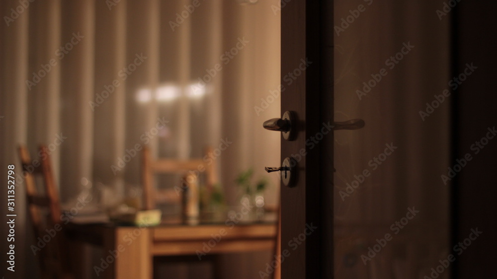Out of focus of an apartment with table, dish, flowers. Nobody present at home. Out of focus of an apartment with table, dish, flowers. Nobody present at home.