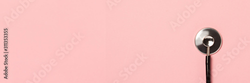 Fotografiet Medical stethoscope on a pink background