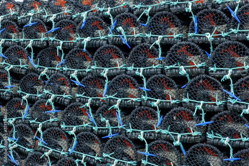 A stack of new plastic Lobster Pots on the harbourside