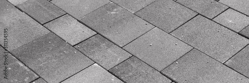 New gray paving stones in the driveway. Gray background
