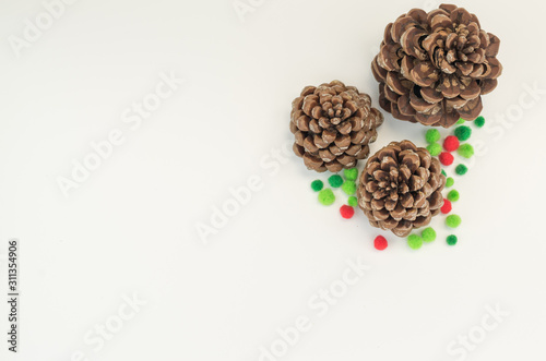 pine cone with decors on a blank surface