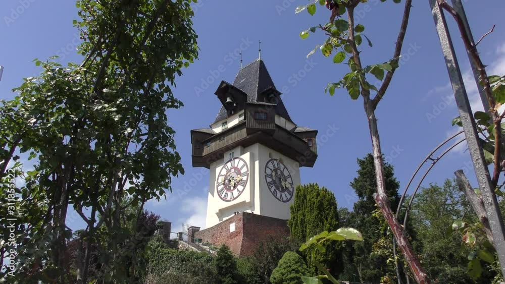The Schlossberg - Castle Hill with the clock tower Uhrturm. The Uhrturm is one of the most famous Landmarks in Austria and UNESCO world Heritage The Schlossberg - Castle Hill with the clock tower Uhrturm. The Uhrturm is one of the most famous Landmarks in Austria and UNESCO world Heritage