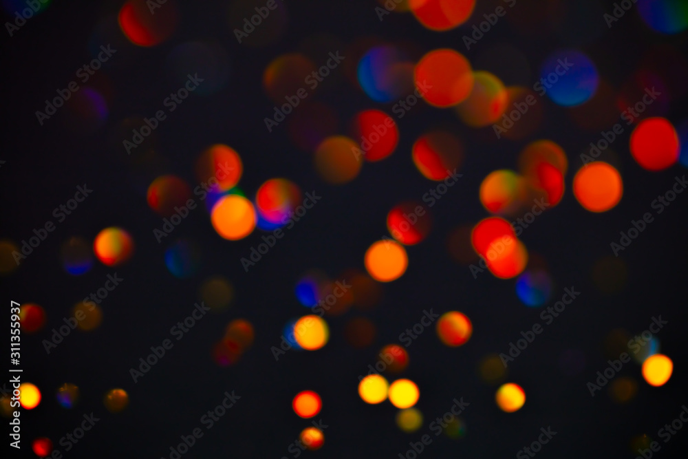 Multicolor glitter raster background. Abstract shimmering red circles on deep purple backdrop. Vibrant bokeh lights effect festive illustration. Overlapping glowing and twinkling spots.