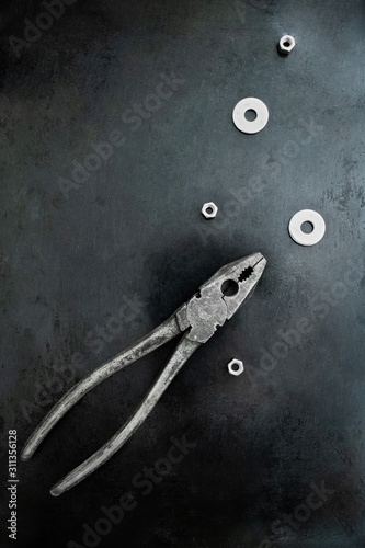 Creative composition with pliers. Creative idea. Abstract fish in the sea.