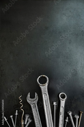 Work tools in a creative composition. Decorative image. Wrenches and screws in the image of grass. Animated objects. Tools. Steel tools decor.