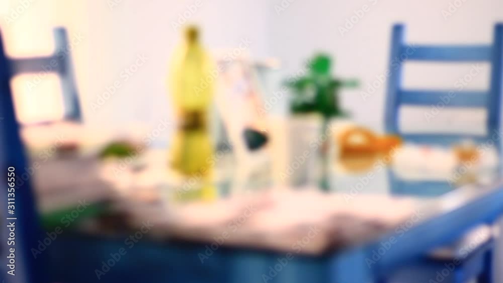 Apartment with table and a lot of items on it, from glass, flask, dinner set, vivid plastic. Apartment with table and a lot of items on it, from glass, flask, dinner set, vivid plastic.