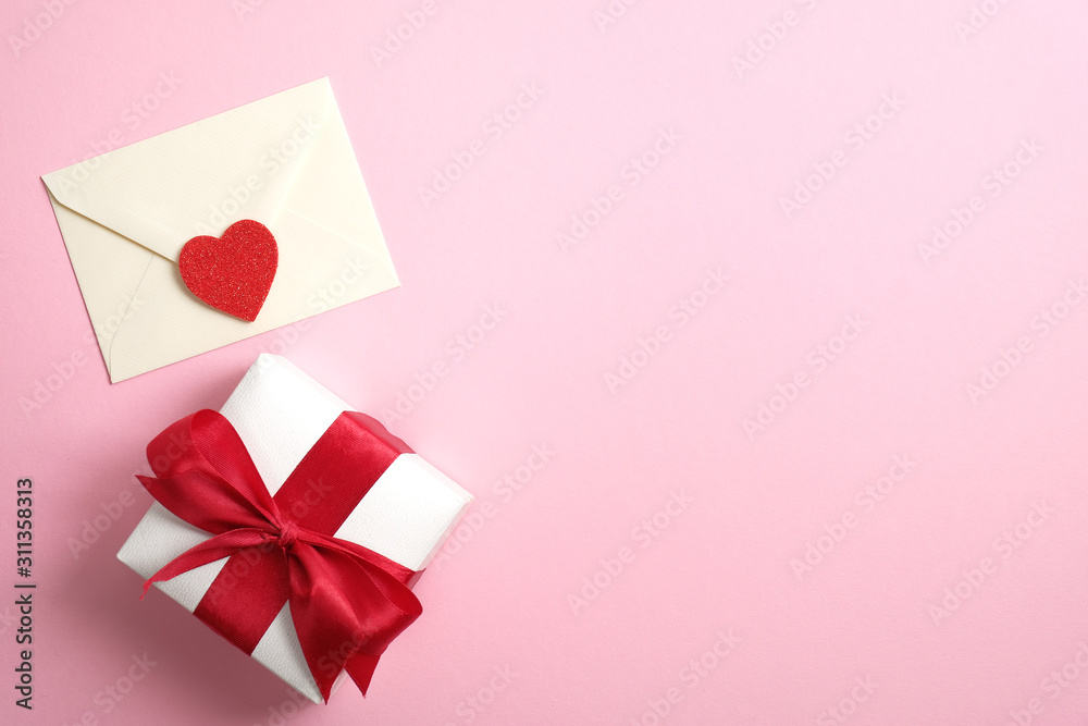 Happy Valentine's Day concept. Romantic composition with love letter and gift box on pink background. Flat lay, top view, copy space. Happy Valentine's Day concept. Romantic composition with love letter and gift box on pink background. Flat lay, top view, copy space.