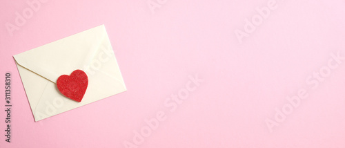 Happy Valentine's Day concept. Wide banner with romantic love letter and red heart on pink background. Flat lay, top view, copy space.